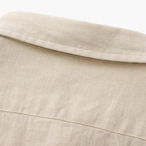 Close-up of beige linen fabric shirt collar and upper back detail by Min butik