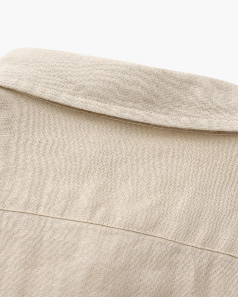 Close-up of beige linen fabric shirt collar and upper back detail by Min butik