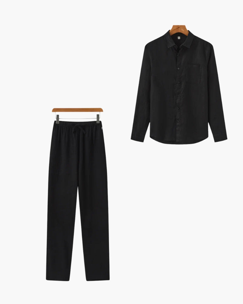 Black long sleeve button-up shirt and matching black drawstring pants set on hangers