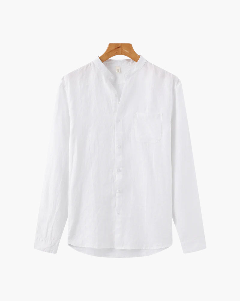 White long sleeve shirt with mandarin collar and front pocket hanging on wooden hanger